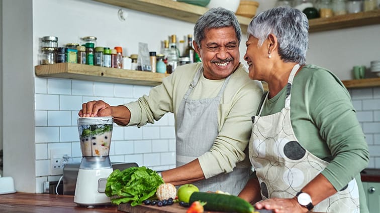 Couple prepares healthy foods in their kitchen
